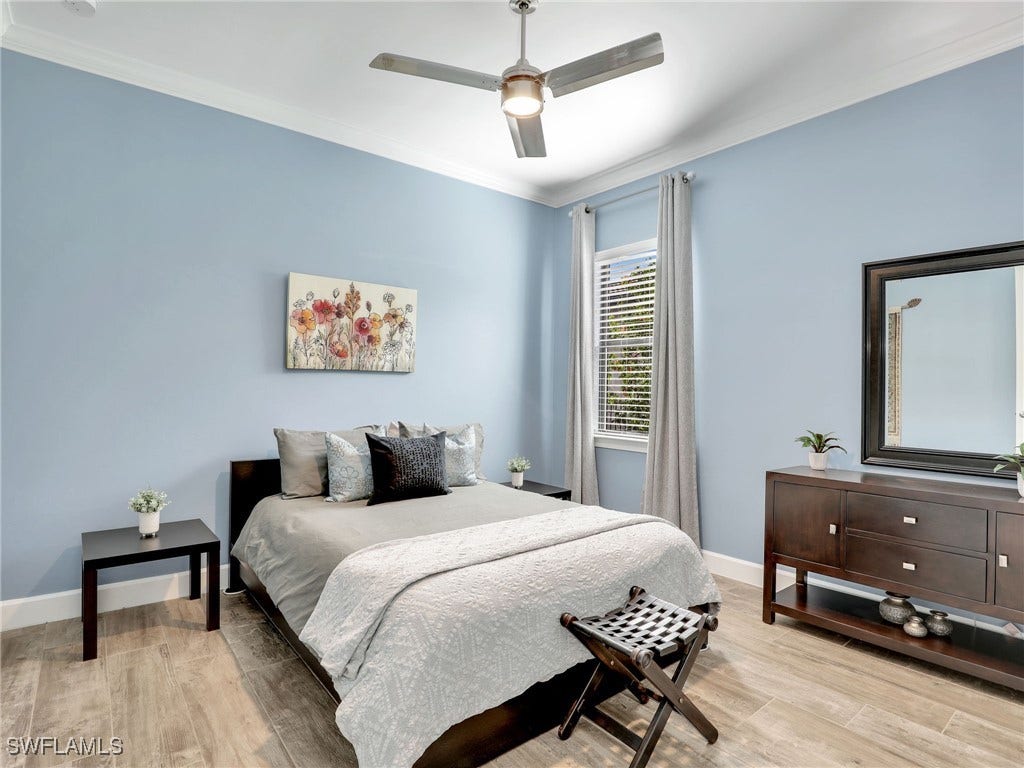 Guest Bedroom 2 with adjacent guest bath and pocket doors for a more ensuite privacy