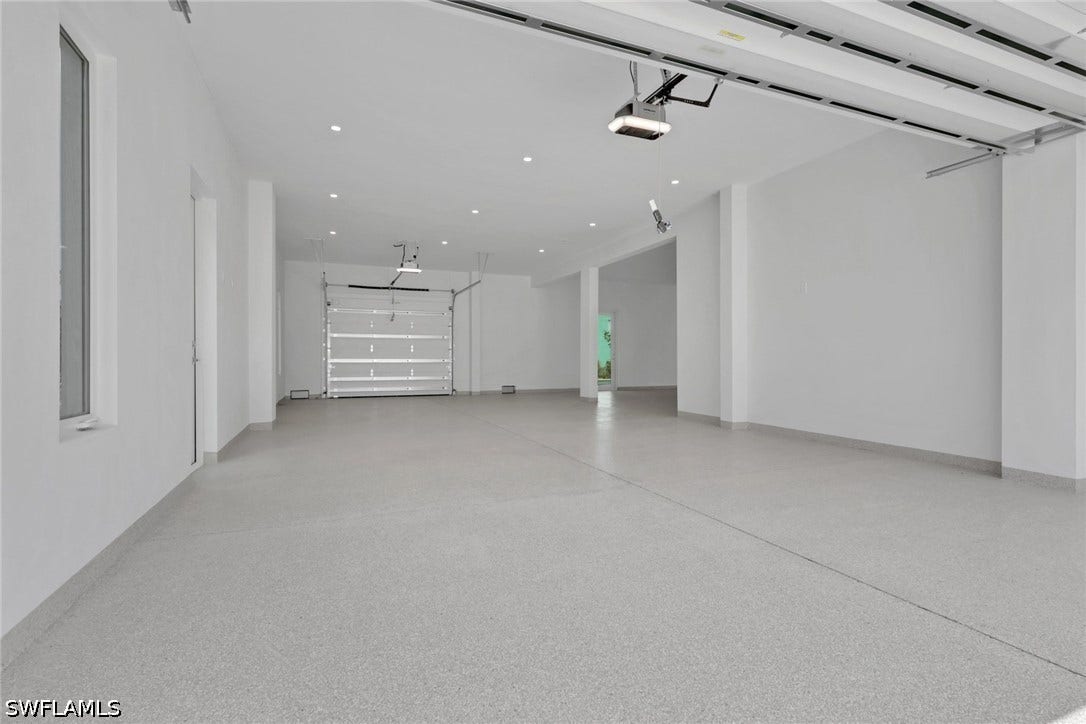 215 1st Street, Bonita Springs, FL 34134 Garage Doors Open to front and back of home