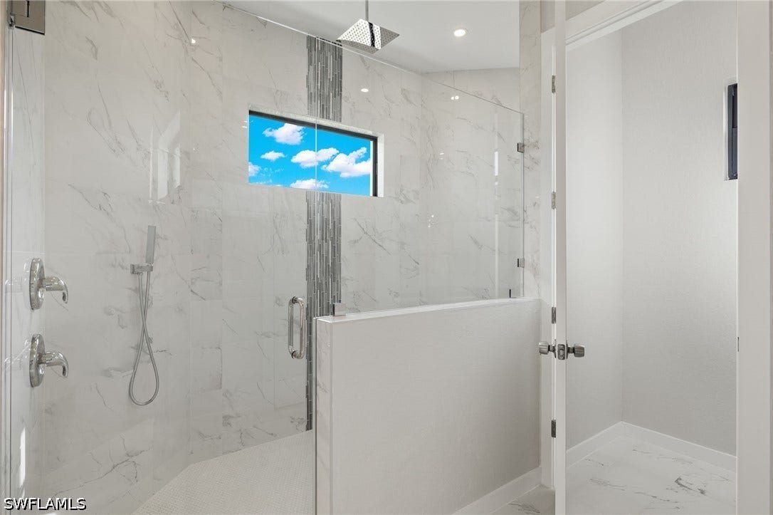4713 6th Street W, Lehigh Acres, FL 33971 XL Shower with custom tile inlay & stainless rain showerhead
