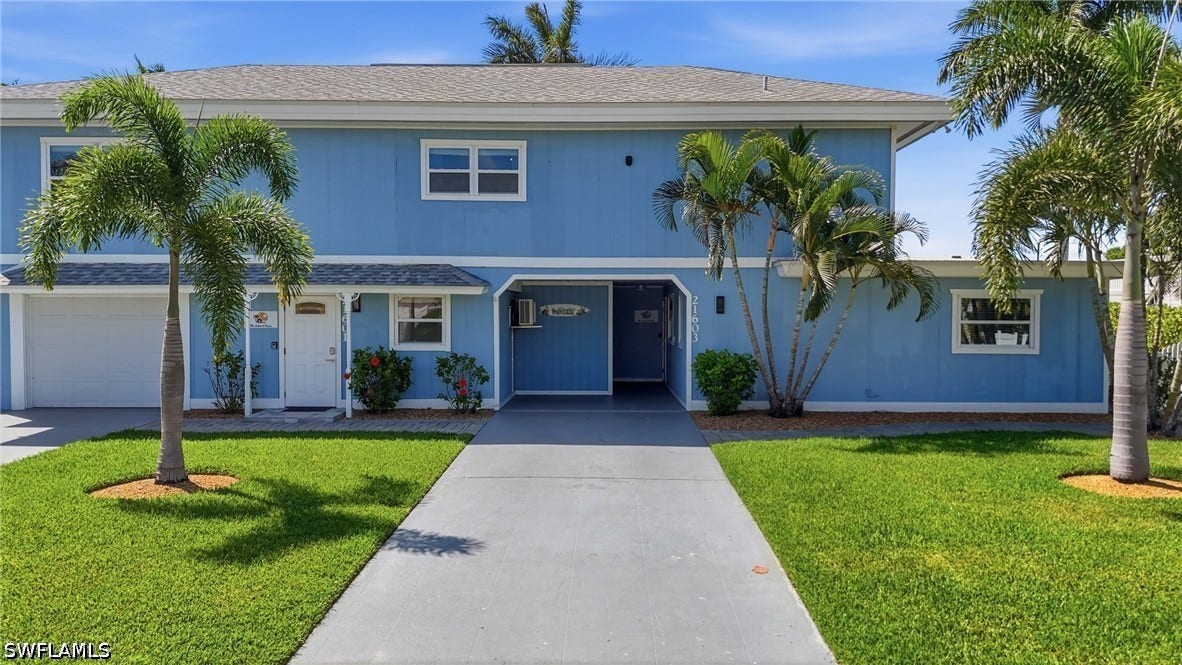 Blue two-story exterior with white trim - Virtually Edited Image