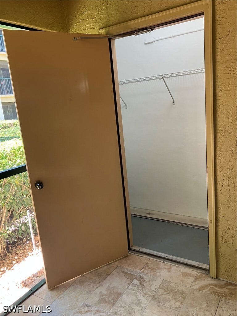 8920 Colonnades Court E, #516, Bonita Springs, FL 34135 STORAGE CLOSET ADJACENT TO SCREENED LANAI