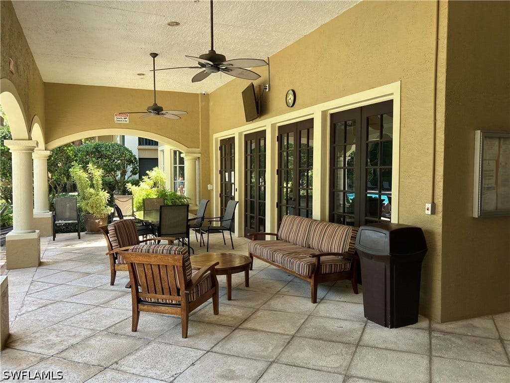 8920 Colonnades Court E, #516, Bonita Springs, FL 34135 GATHERING AREA at the Pool NEXT TO COMMUNITY ROOM