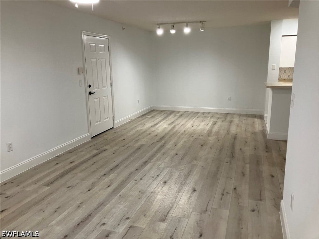 8920 Colonnades Court E, #516, Bonita Springs, FL 34135 TOTALLY REPAINTED AND VINYL PLANK FLOORING INSTALLED