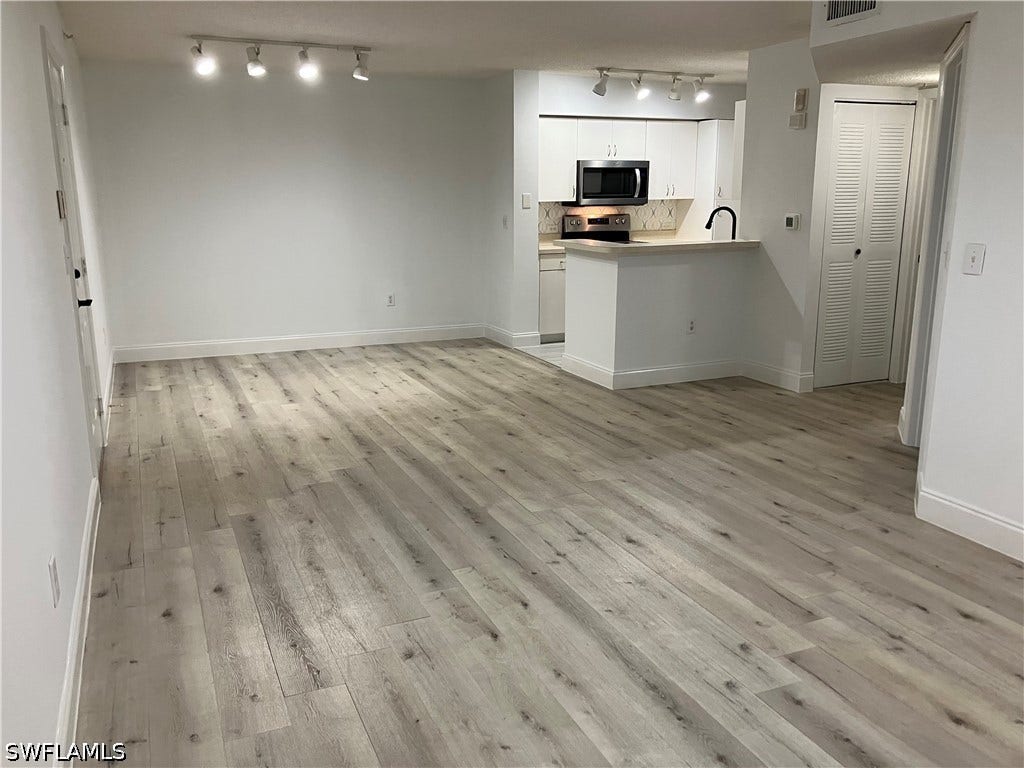 8920 Colonnades Court E, #516, Bonita Springs, FL 34135 TOTALLY REPAINTED AND VINYL PLANK FLOOR INSTALLED