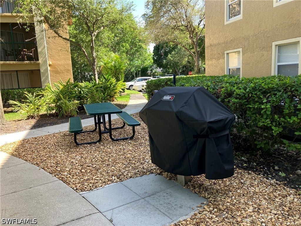 8920 Colonnades Court E, #516, Bonita Springs, FL 34135 BBQ GRILL AND SEATING AREA