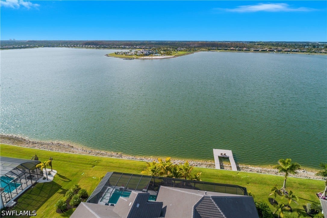 Oversized estate lot with custom 15' x 20' dock with AZEK decking overlooks WildBlue Lake.