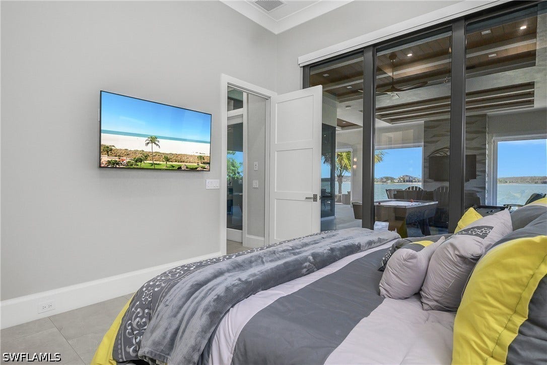 Guest Suite #1 with ensuite bath overlooking WildBlue lake with private sliding door entry.
