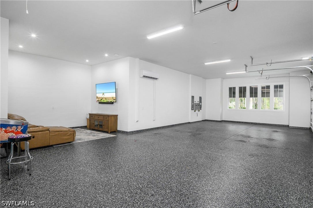 Oversized 3-4 car garage with bonus area--perfect for game room or at home gym on the NORTH side of the home.