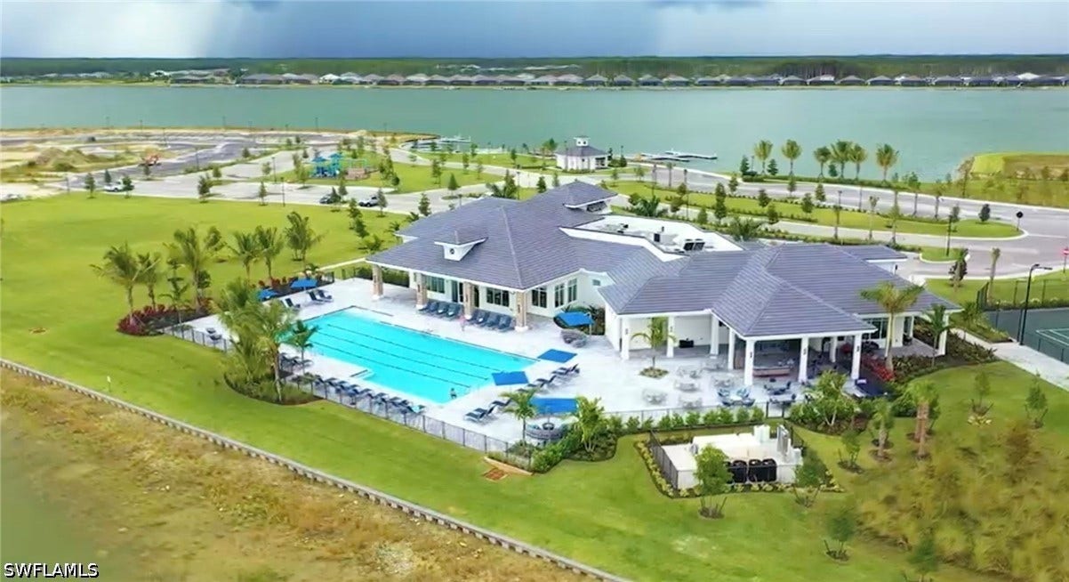 WildBlue Sports Club with lap pool, attended fitness center, spin room, yoga room, his/hers saunas, tennis pro shop, 8 pickleball courts, 4 tennis courts, bocce courts, and a full sized basketball court.