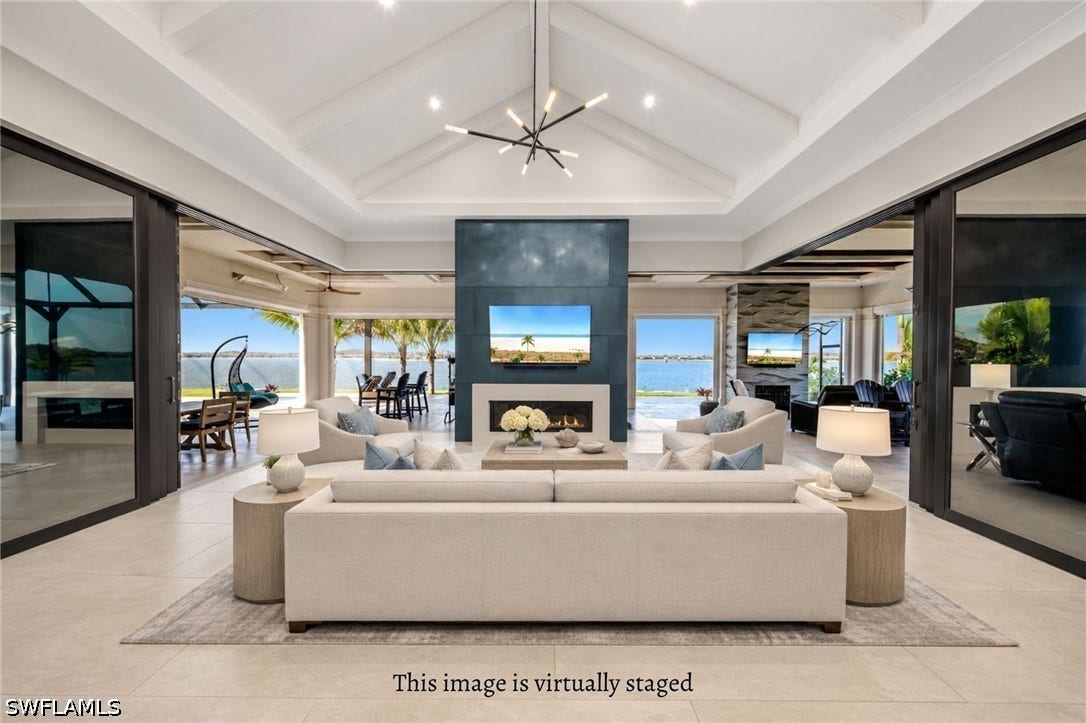 With zero-corner sliders and pocketing doors fully open, the interior and expansive lanai blend effortlessly into one incredible indoor-outdoor living space. *This image is virtually staged.