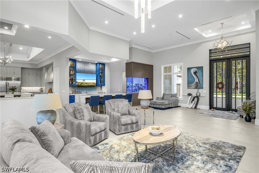 This home is an entertainer's dream, with a large gathering great room accented by a social bar at entry--perfect for happy hour and appetizers.