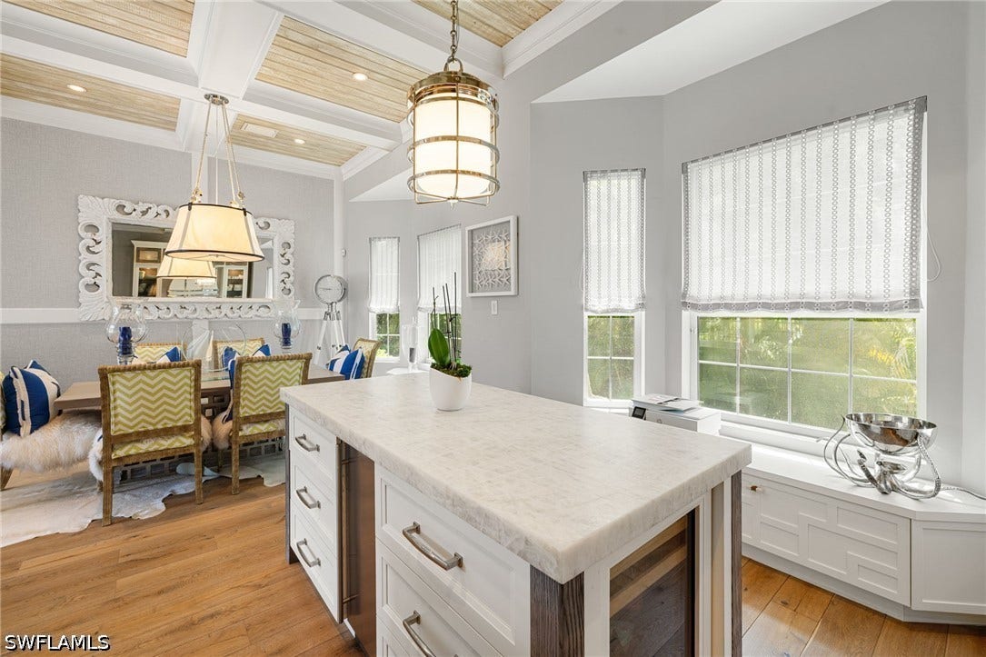 510 2nd Street S, #102, Naples, FL 34102 Kitchen island and dining area