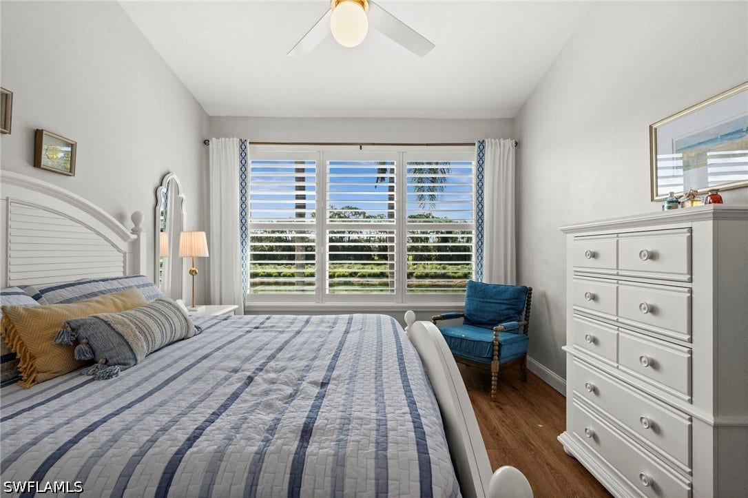 Wood-finish flooring with white baseboards