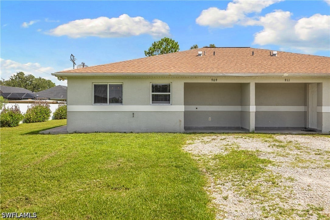 909/911 Jaguar Boulevard, Lehigh Acres, FL 33974 909/911 Jaguar Boulevard, Lehigh Acres, FL 33974