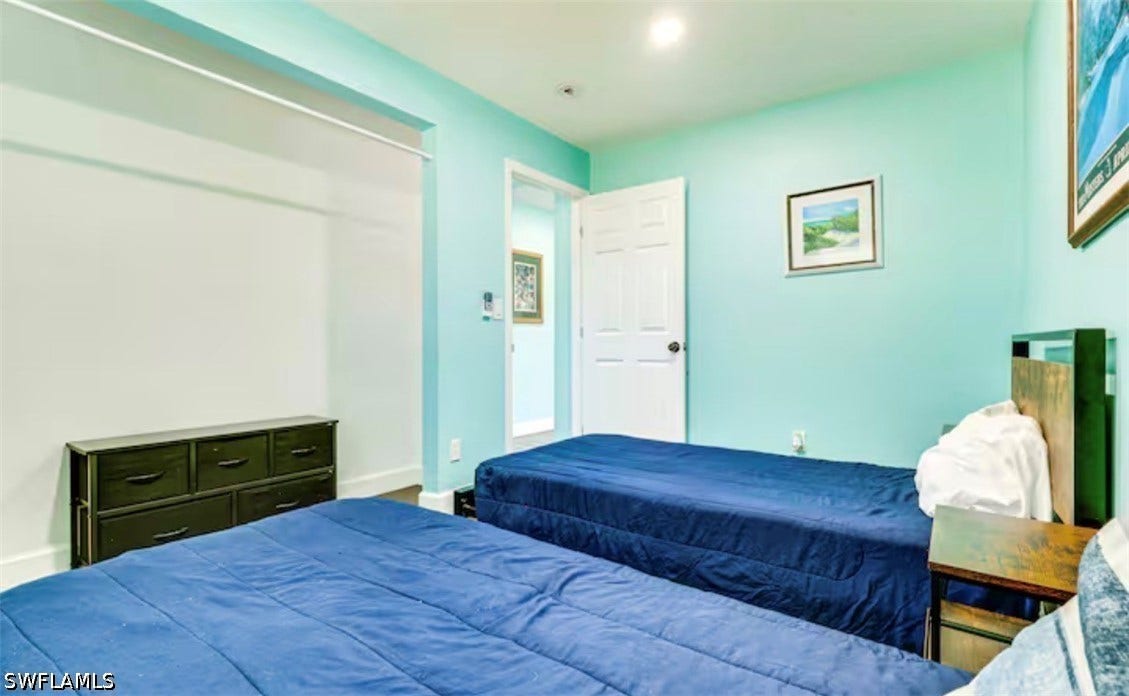 4630 New Haven Drive, Fort Myers, FL 33908 Open closet with built-in hanging rod, recessed lighting, and a white paneled door