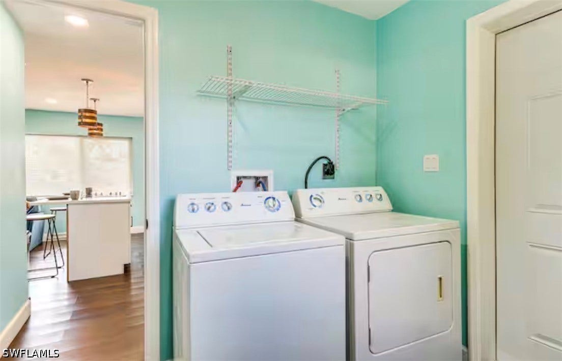 4630 New Haven Drive, Fort Myers, FL 33908 Laundry area with wire shelving, light blue walls, and a white paneled door