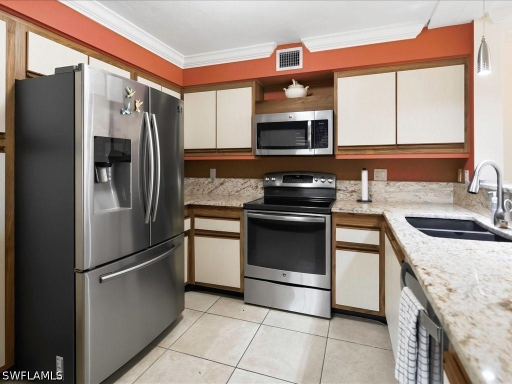 Newer stainless appliances, tile flooring, granite counters, "Sila Granite" double sink, newer faucet and pendant lighting.