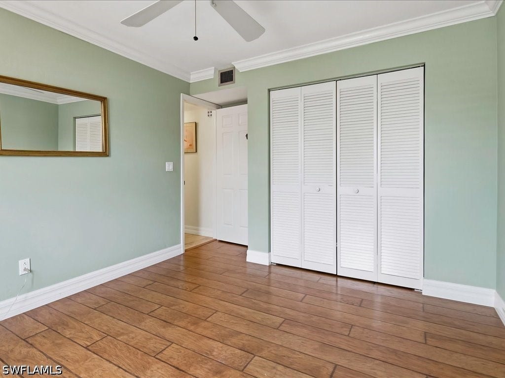Guest BR with double closet.  The guest bath is around the corner on the left.  There is a full-sized linen closet in the hallway.