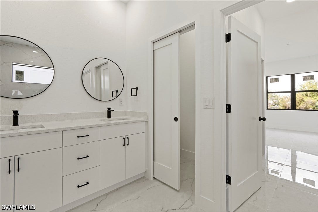 532 Lone Star Lane, Lehigh Acres, FL 33974 Dual vanity with undermount sinks and matte black faucets