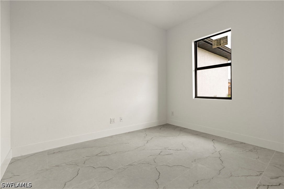 532 Lone Star Lane, Lehigh Acres, FL 33974 Recessed window with black framing
