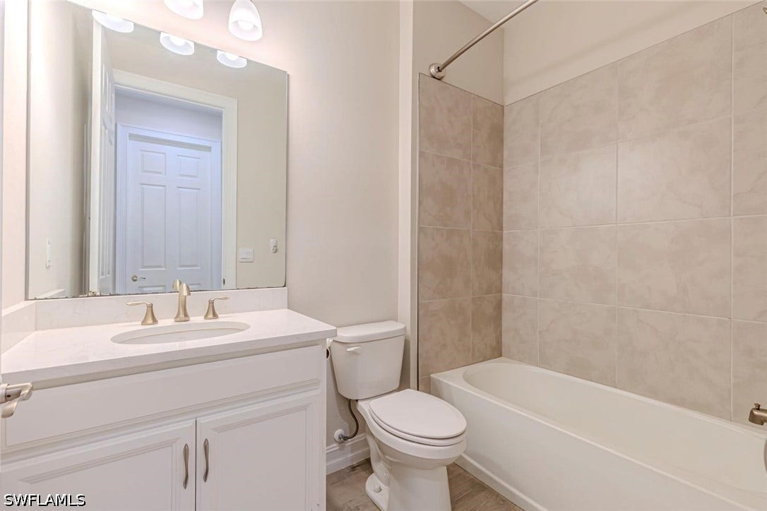 Full bath with tub / shower combination and vanity