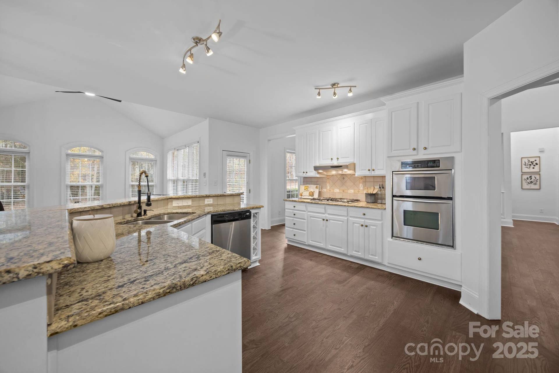 open kitchen with island/bar.  Gas stove, microwave and oven