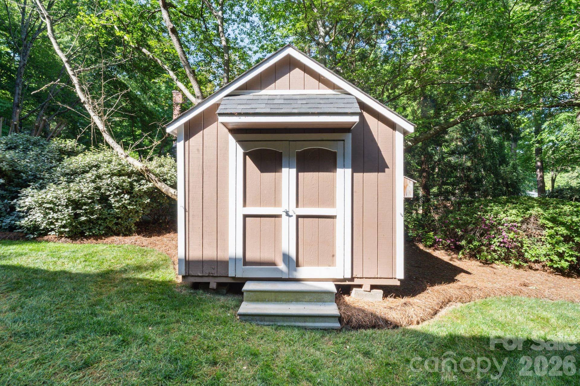 Shed for yard and garden tools.