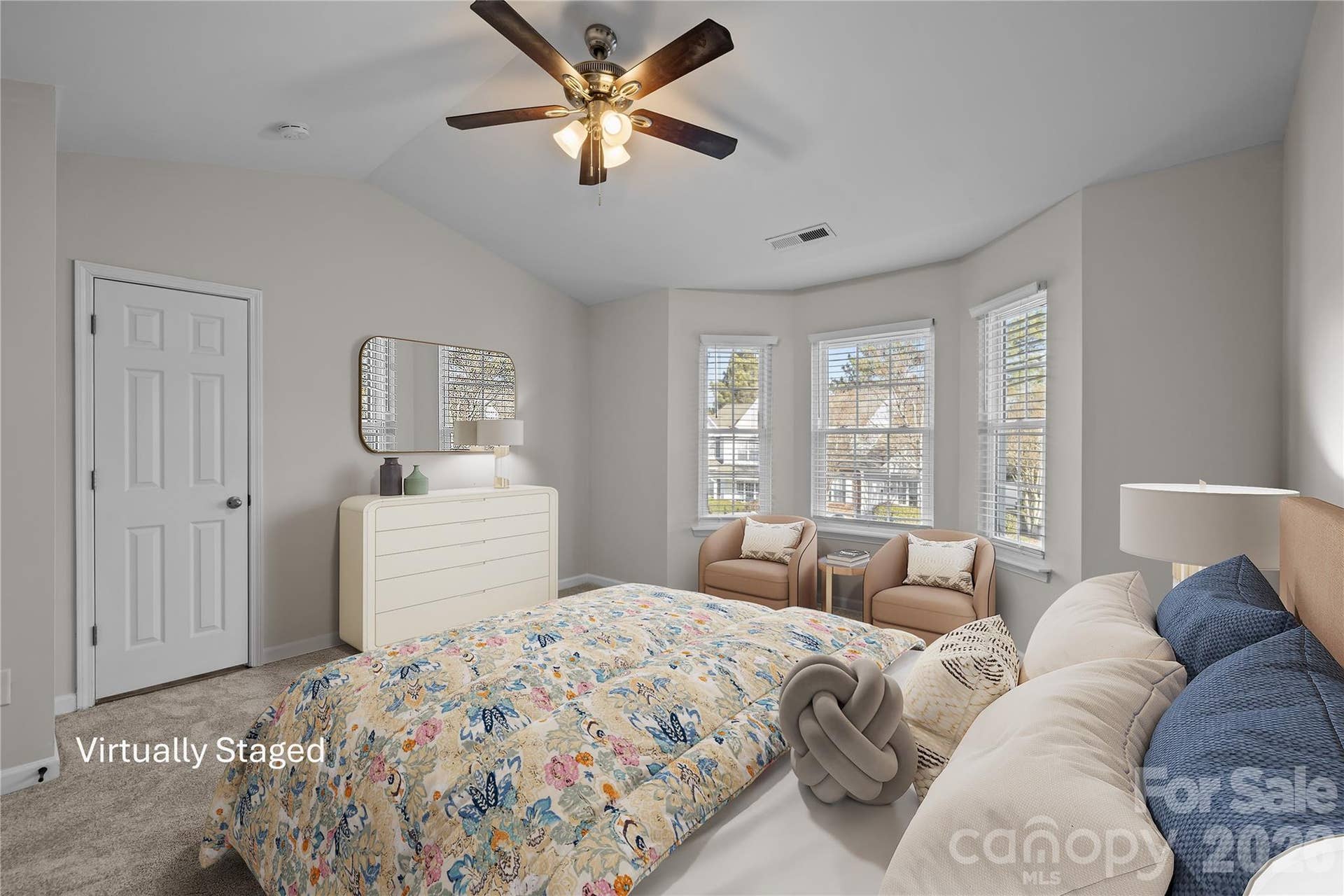 Serene primary suite features en-suite bathroom, walk-in closet, brand new carpet, ceiling fan with light, fresh paint throughout. Plenty of space for a king-size bed.