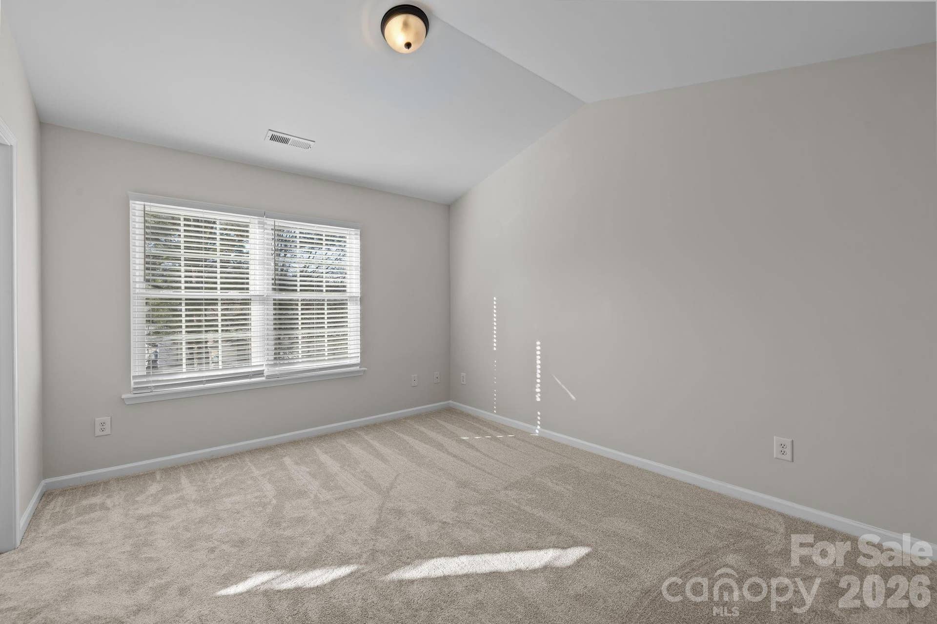 One of two self-contained bedroom suites with no shared walls in the townhome making it ideal for a roommate living situation.