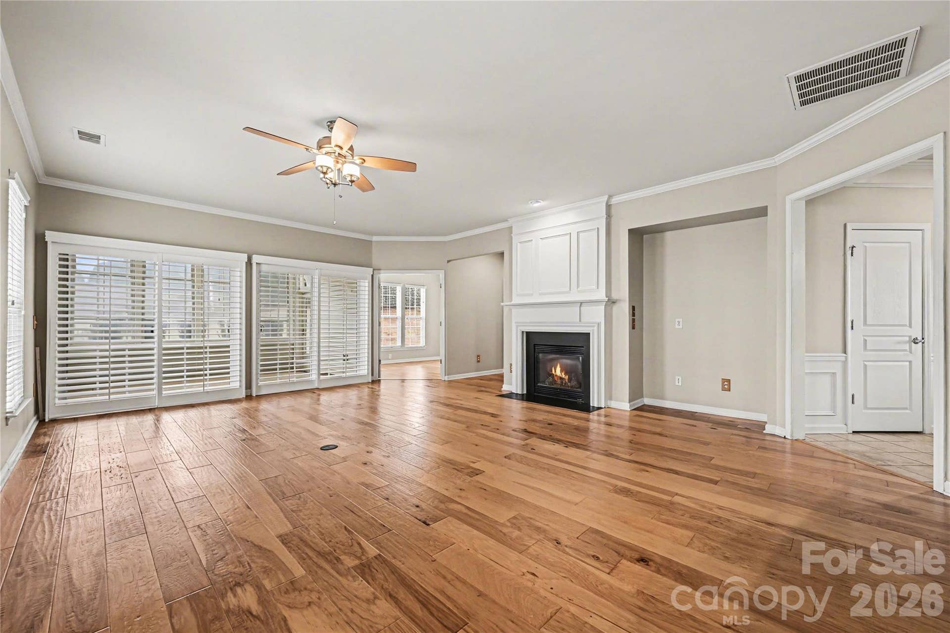 57106 Nightingale Way, Indian Land, SC 29707 Beautiful great room has sliding louvered doors that open out to the 3-season screened porch.