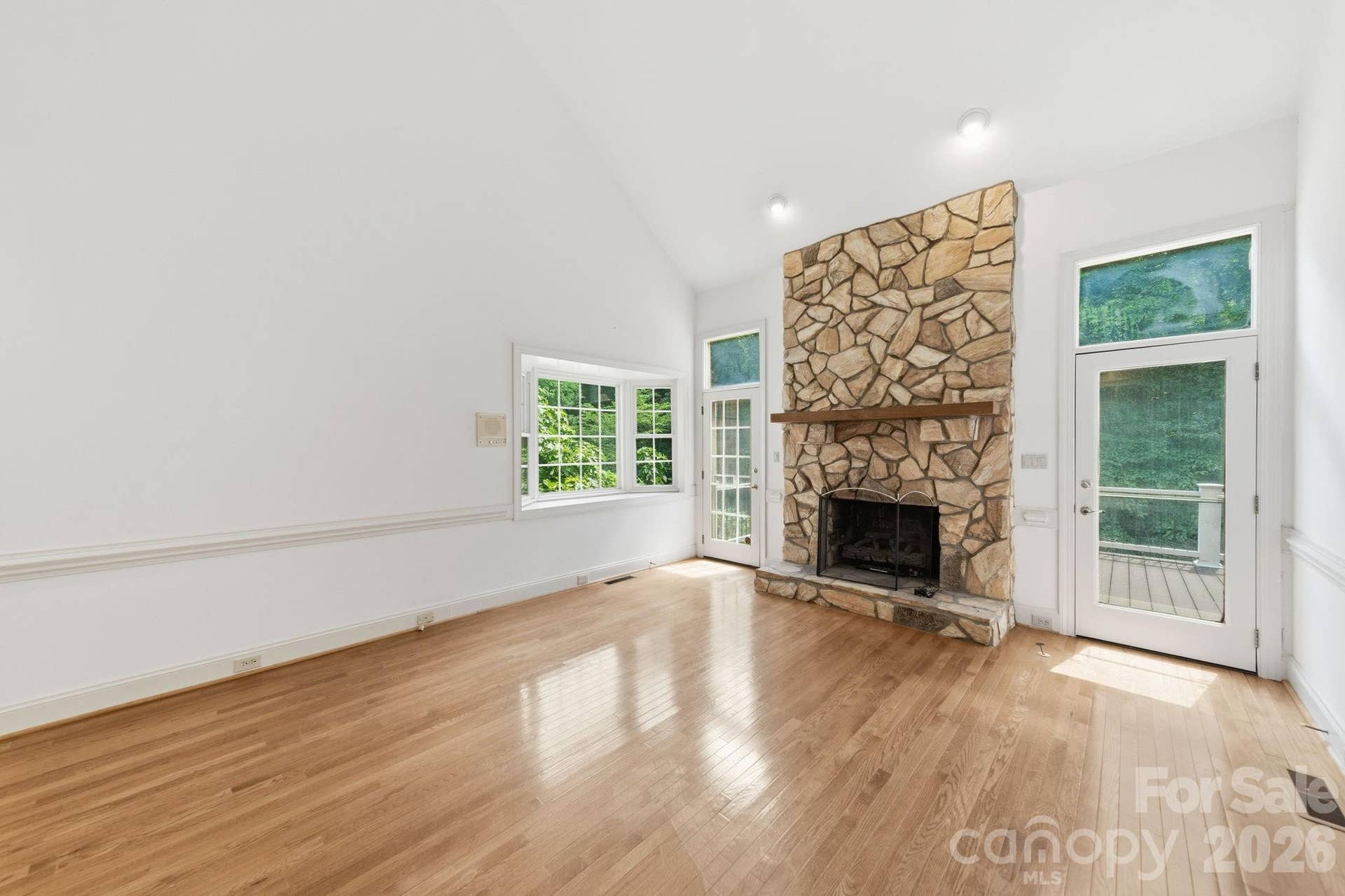 5215 Silchester Lane, Charlotte, NC 28215 Gas fireplace with doors leading to the deck