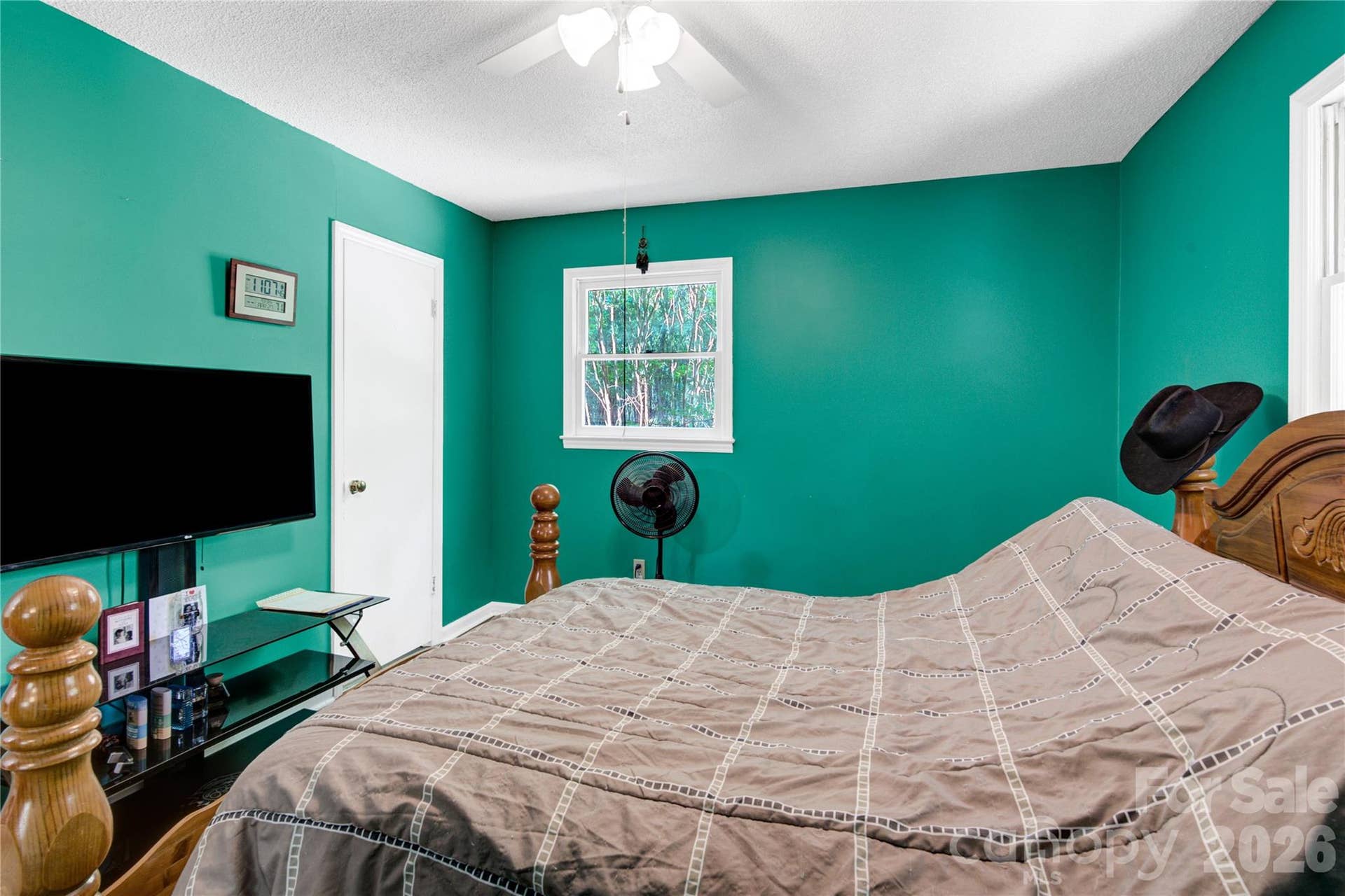 Primary bedroom with closet and 1/2 bathroom