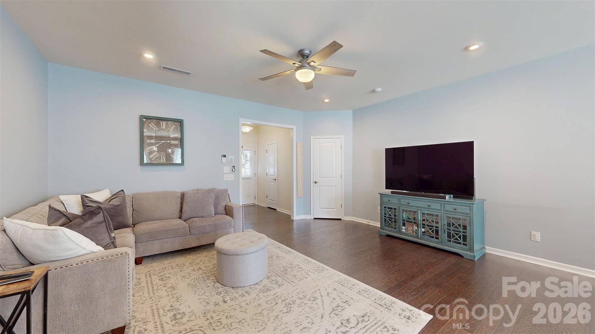 Spacious open Living room with beautiful engineered hardwood floors.