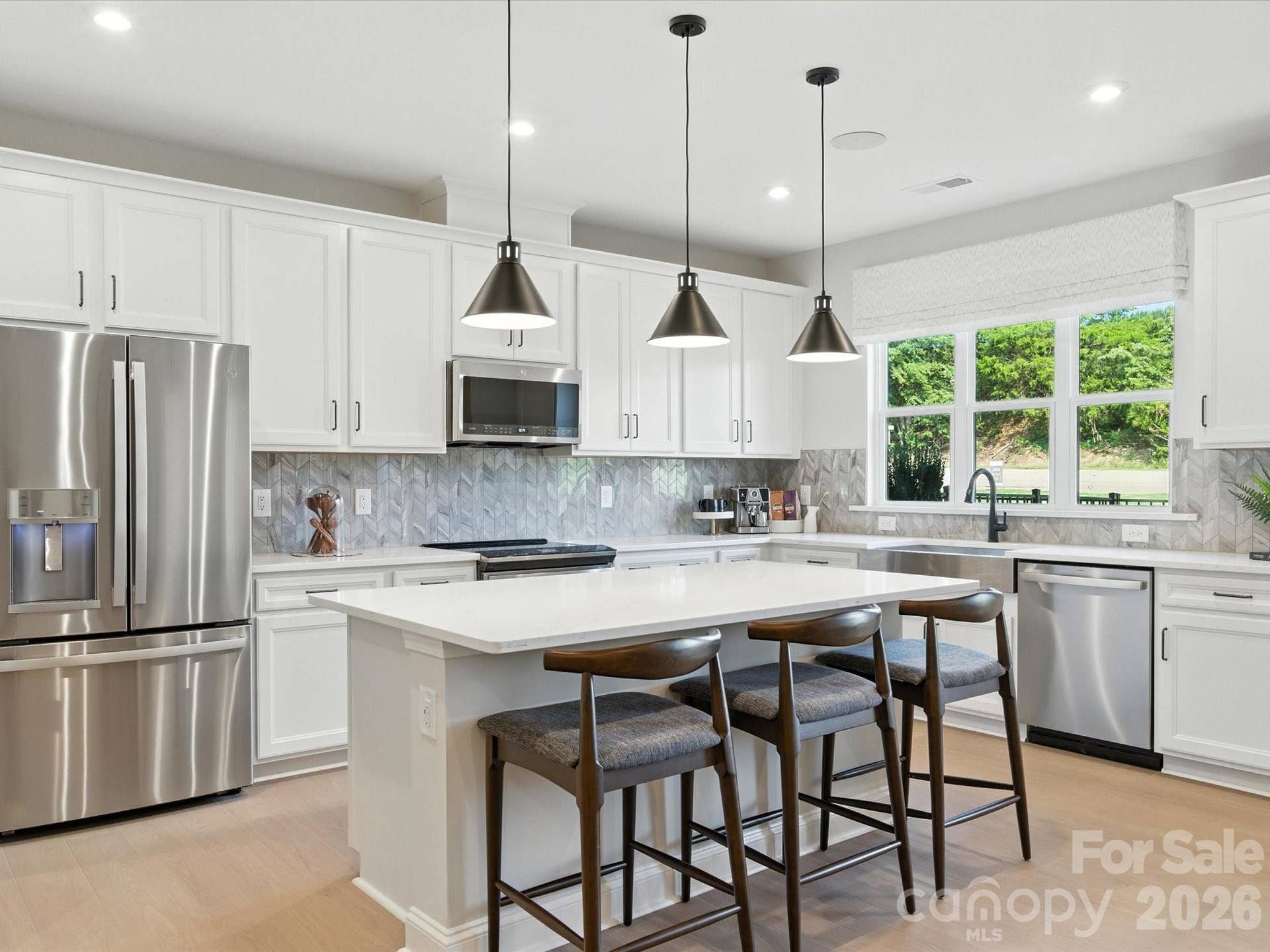 513 Nash Street, Fort Mill, SC 29715 Chef-inspired kitchen with white cabinets and white quartz countertops