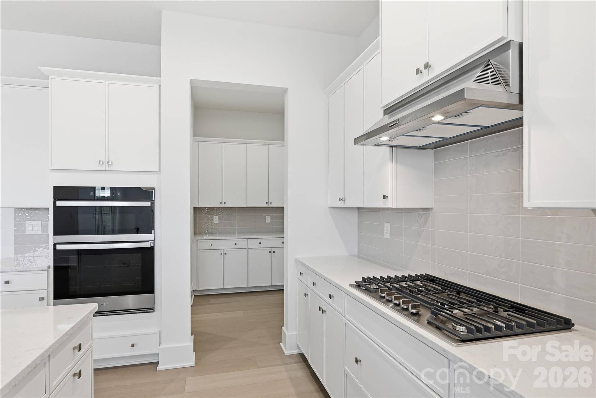 3671 Blue Pine Drive, #177, Indian Land, SC 29707 Coffee bar butler's pantry niche is perfectly tucked away behind the main kitchen space.