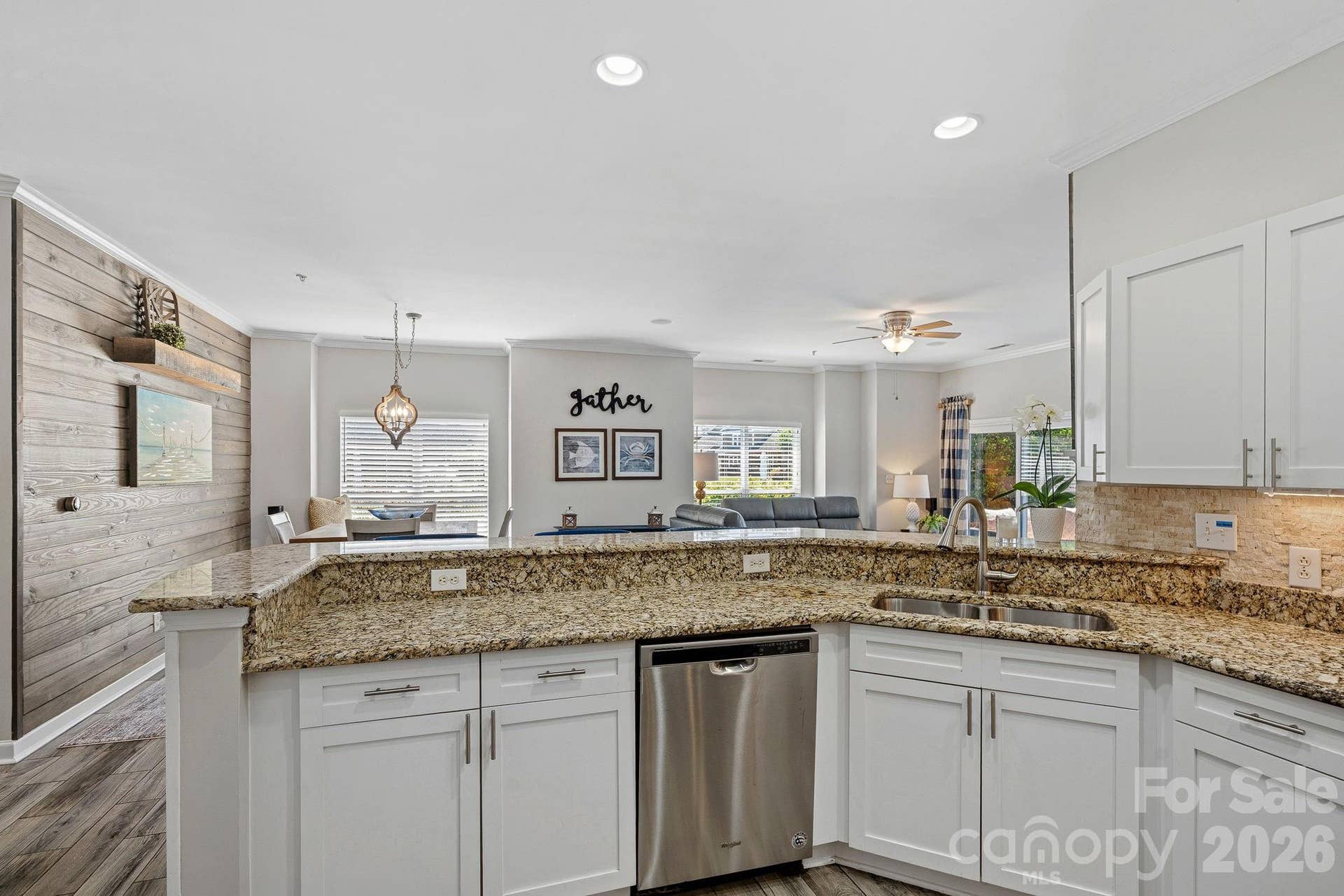 Thoughtfully designed for everyday living and entertaining, the open kitchen features stainless steel appliances, abundant storage, and generous counter space for effortless meal preparation.