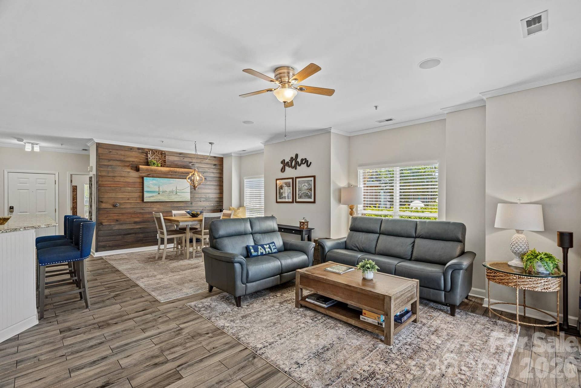 The open-concept great room is filled with natural light, enhanced by the additional windows unique to this end-unit location.