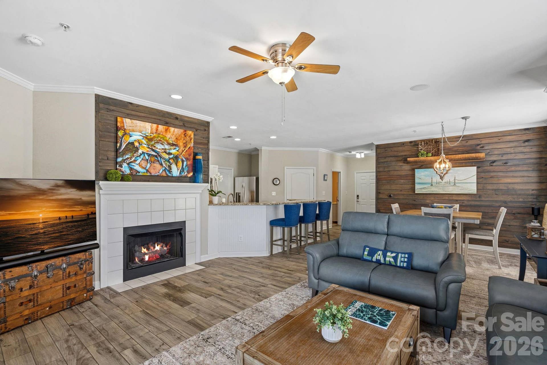 The open-concept great room is filled with natural light, enhanced by the additional windows unique to this end-unit location.