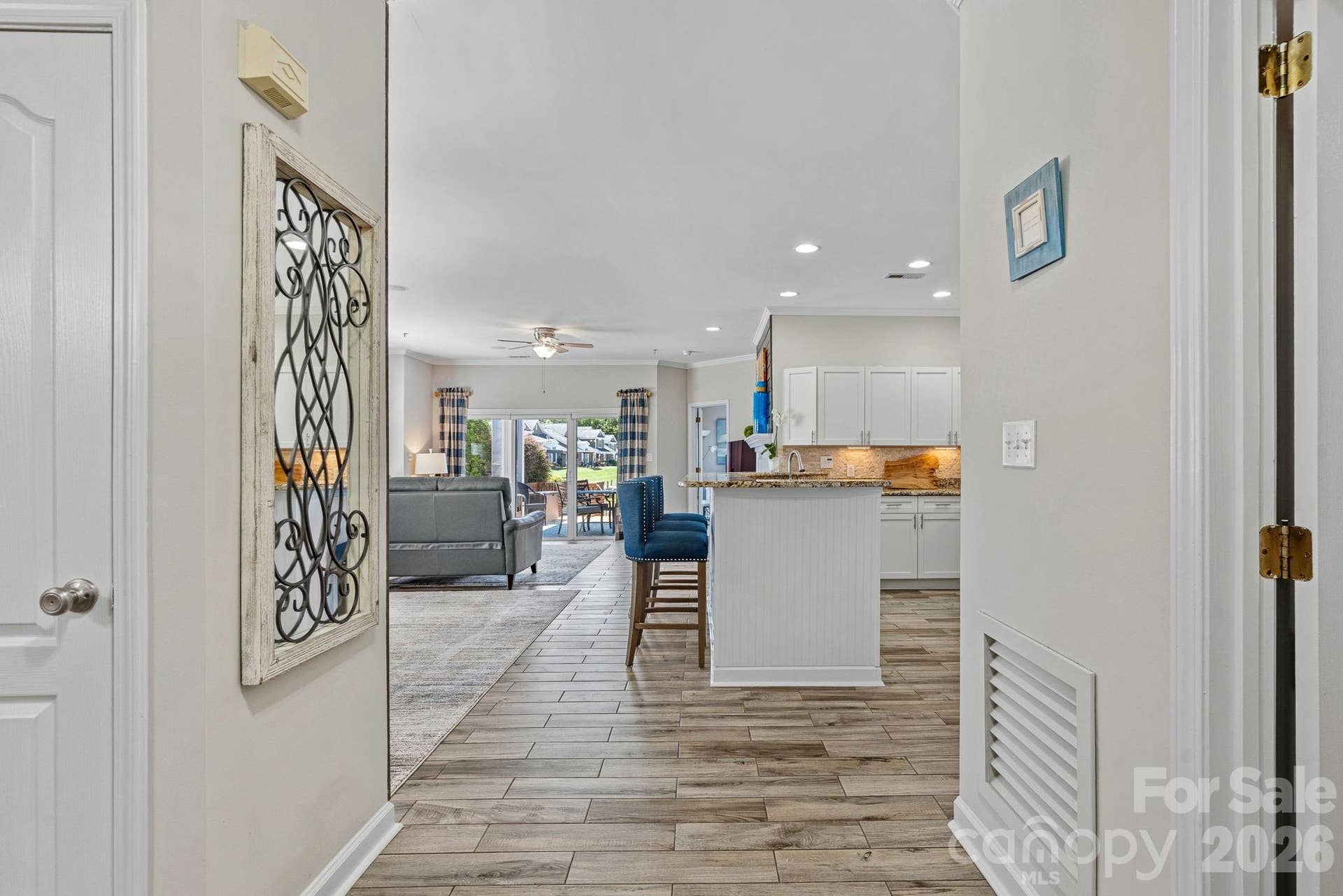 18609 Harborside Dr. greets you with bright, open spaces, flowing straight to the covered patio where Lake Norman views await!