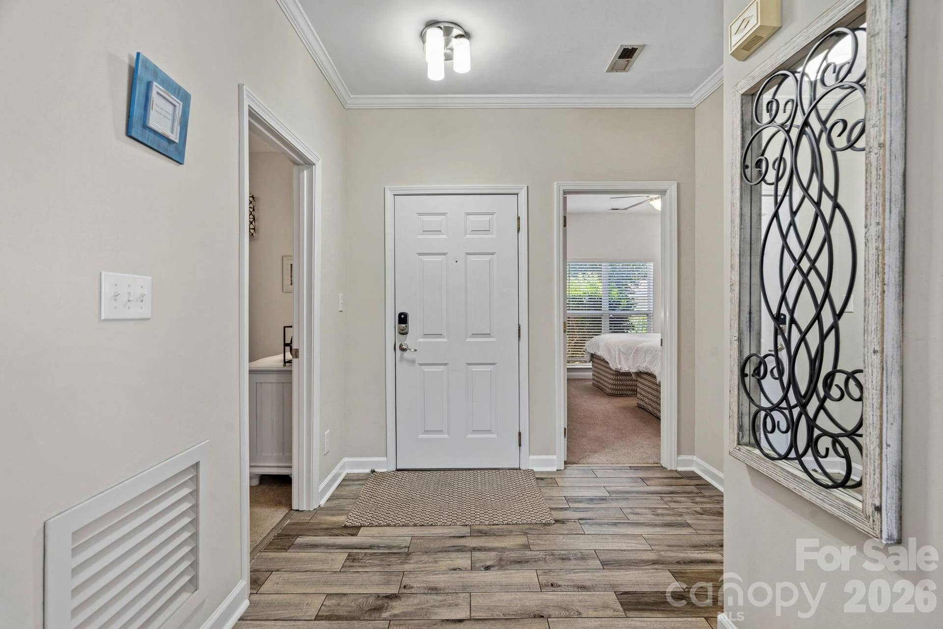 Wide entry foyer adjacent to two guest bedrooms and recently updated full guest bathroom.