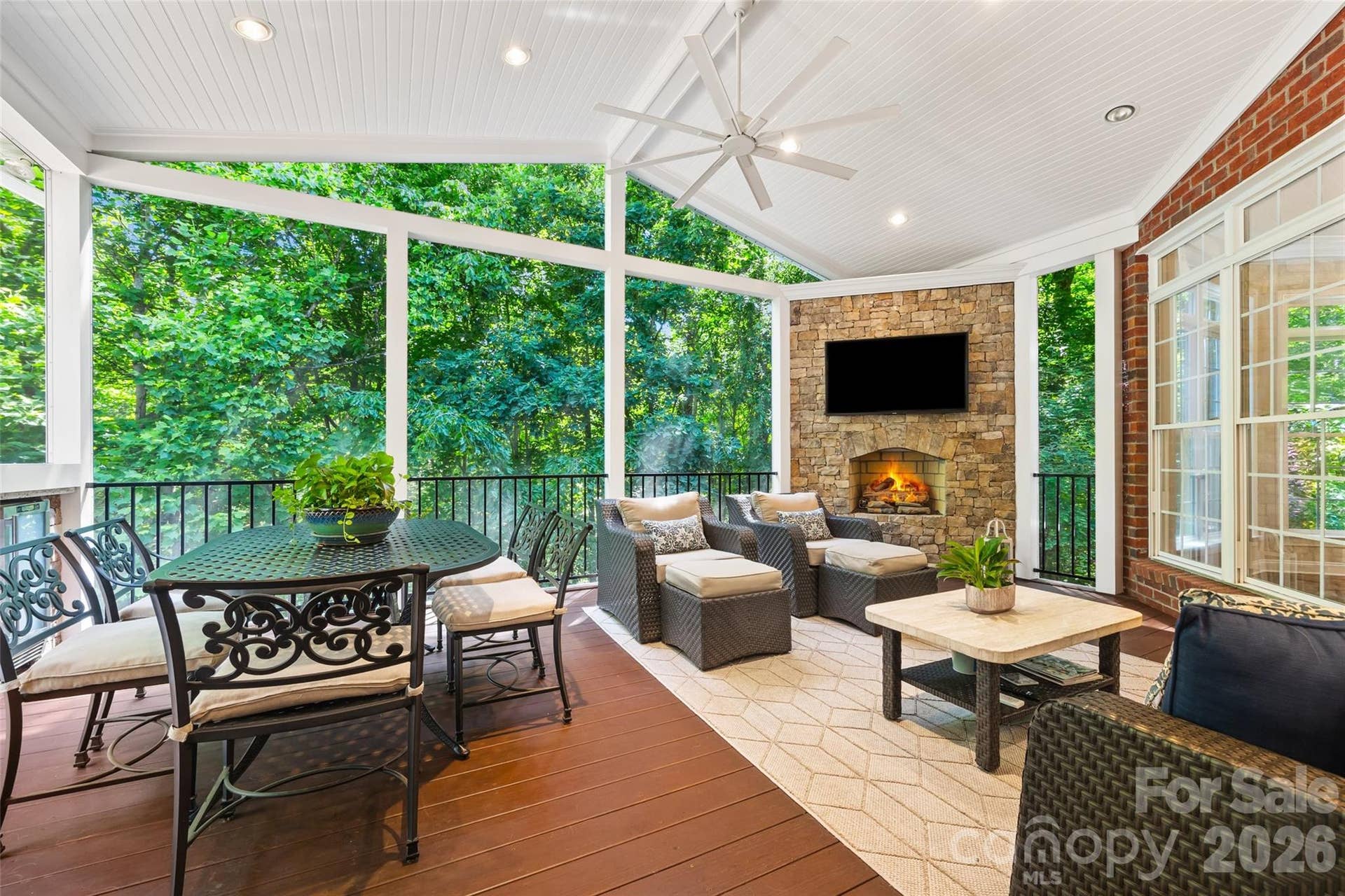 2539 Grimmersborough Lane, Charlotte, NC 28270 Screened porch with gas log fireplace and beverage fridge