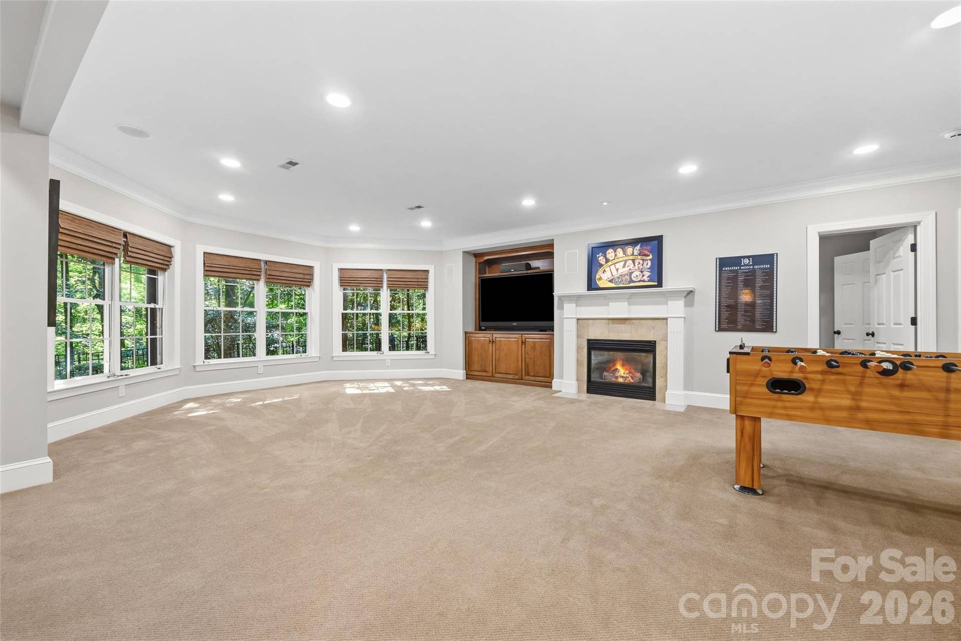 2539 Grimmersborough Lane, Charlotte, NC 28270 Basement with built-ins and gas log fireplace