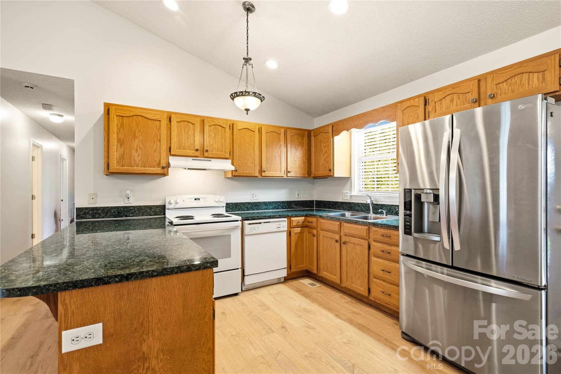 3892 Stoney Creek Drive, Lincolnton, NC 28092 Open kitchen with a breakfast bar, ample cabinet space, and generous countertops.