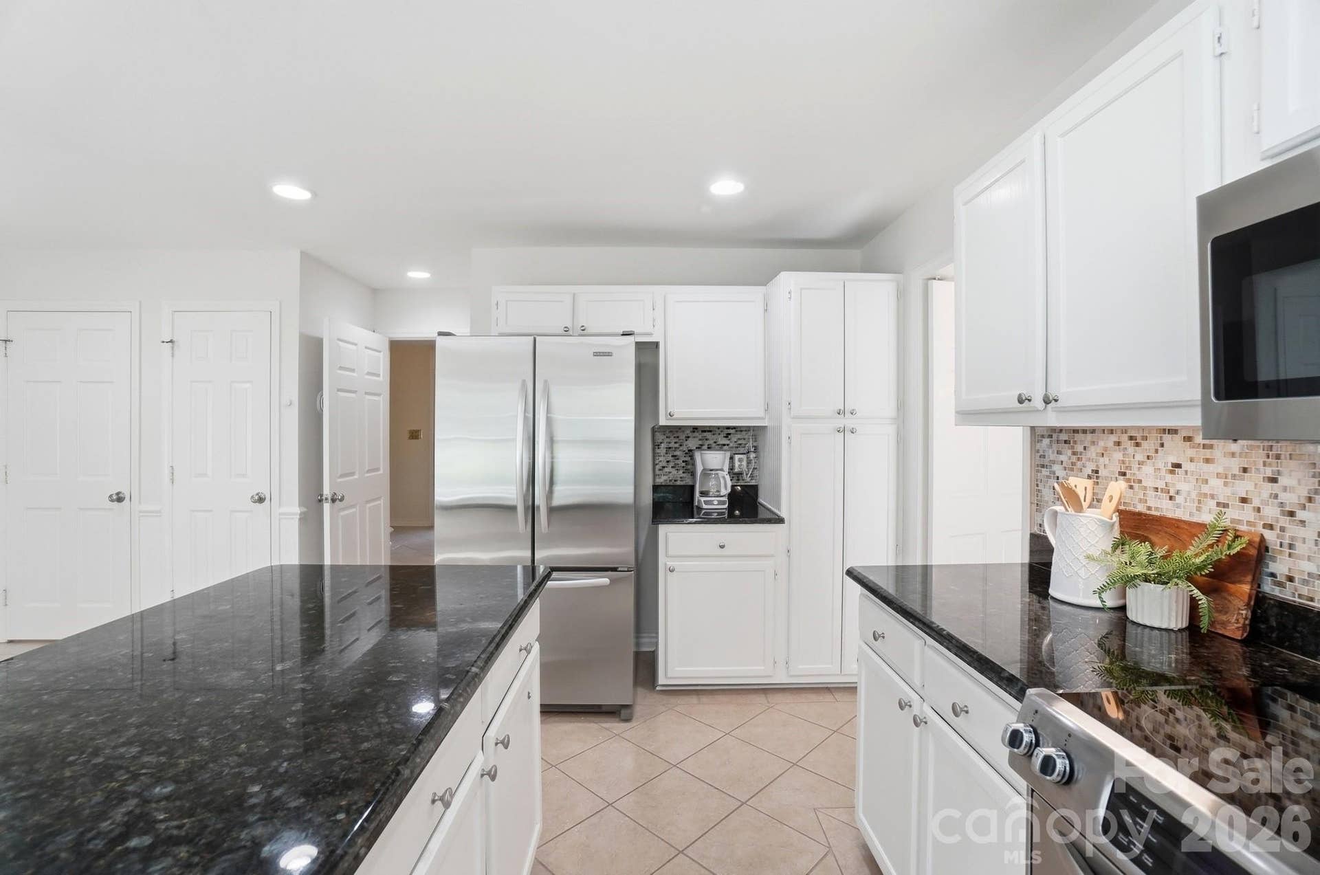 Kitchen w/Stainless Steel Refrigerator, Ample Cabinet Storage