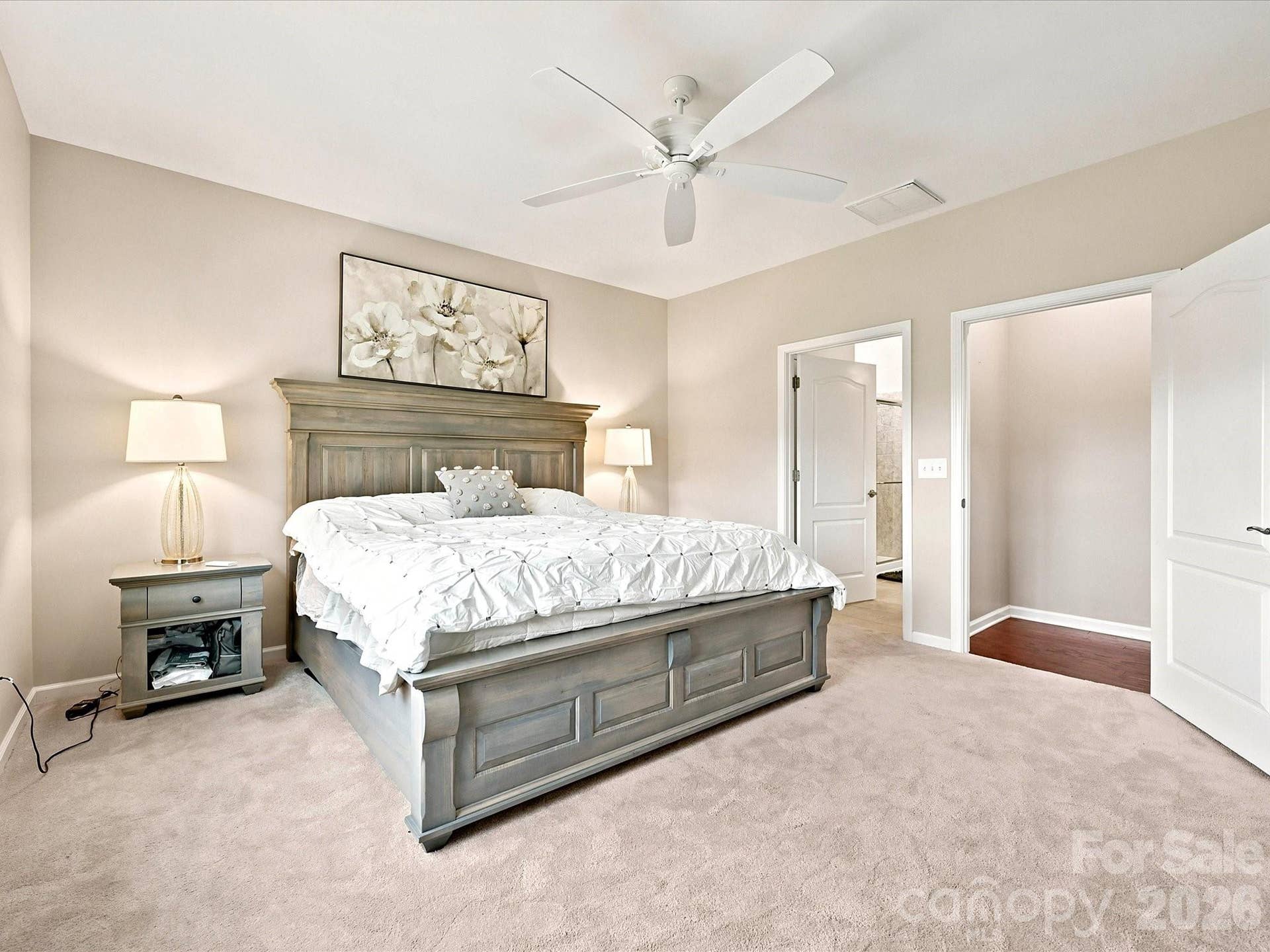 Primary bedroom with ceiling fan