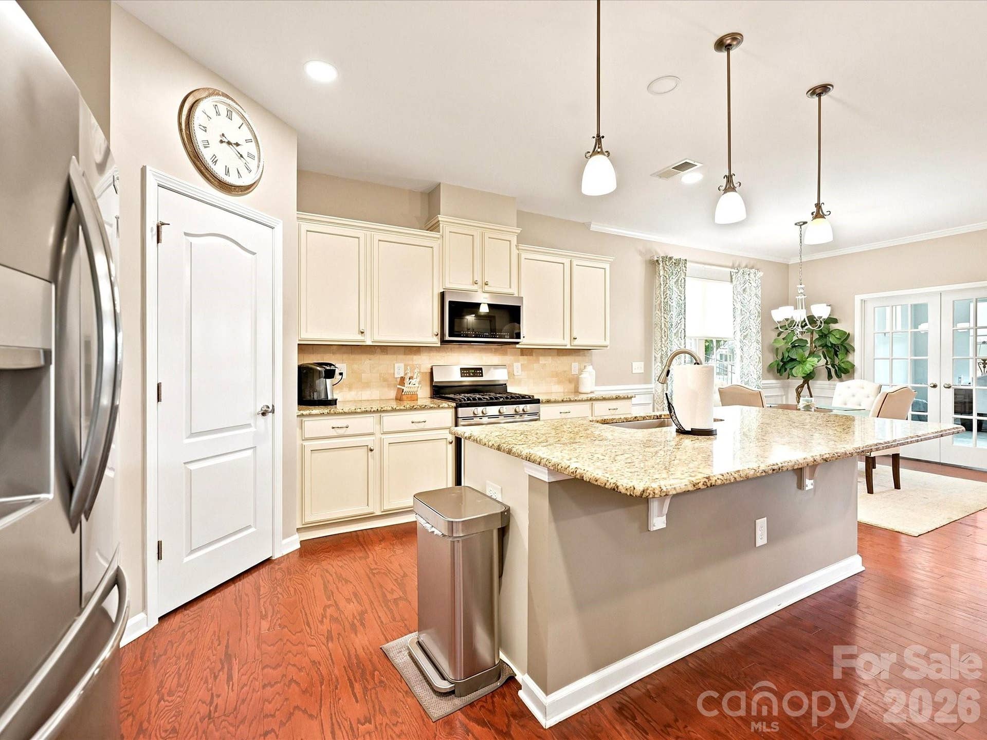 French vanilla cabinets, stainless steel appliances