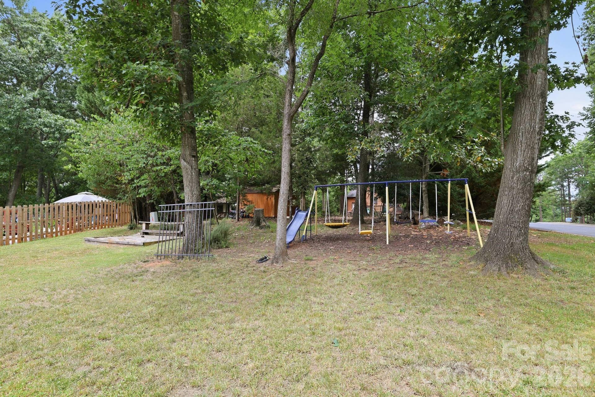 7038 Chelsea Day Lane, Tega Cay, SC 29708 Playground in Private Wooded Backyard