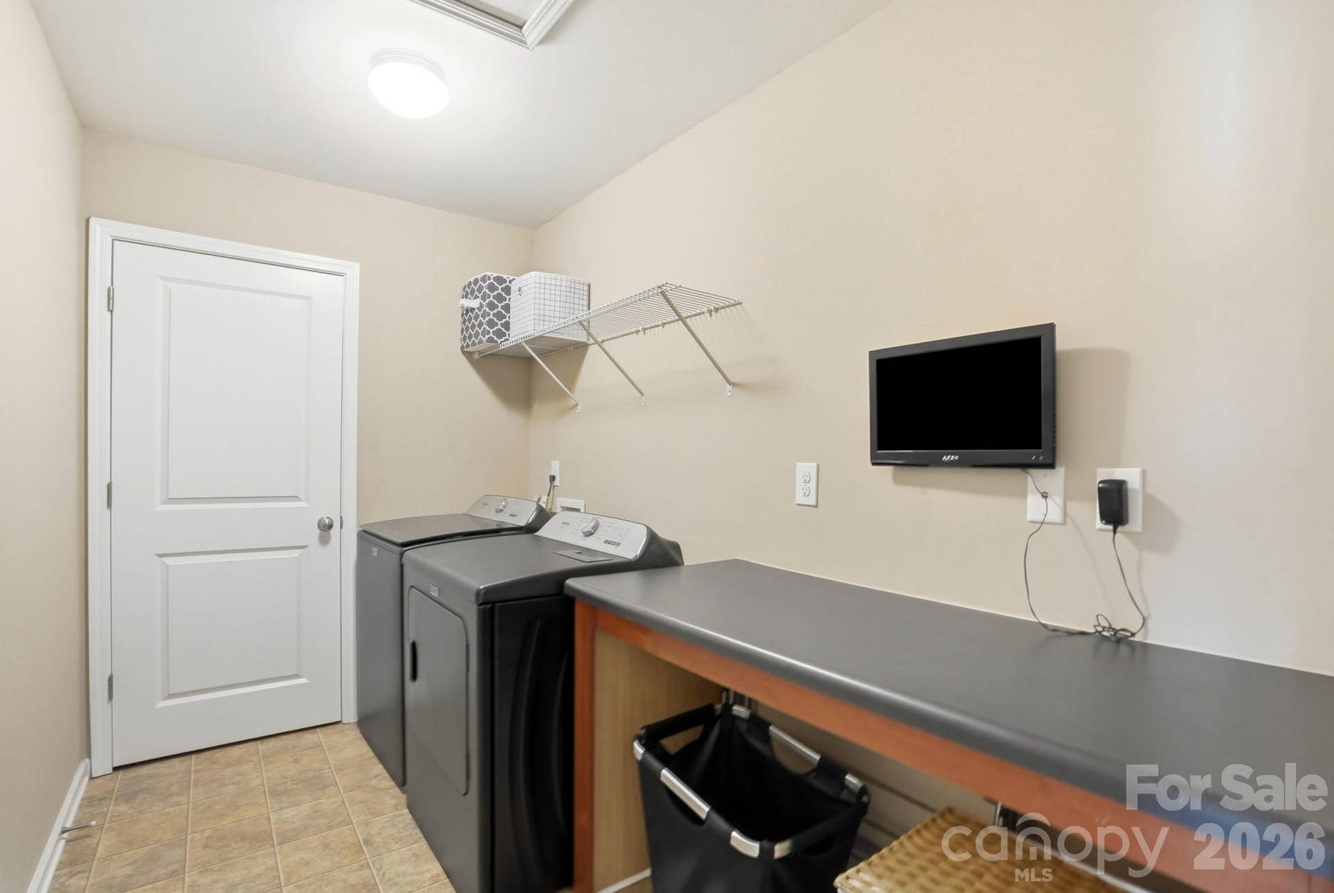 1198 Jasmine Drive, Fort Mill, SC 29707 Large laundry room with folding table and storage closet