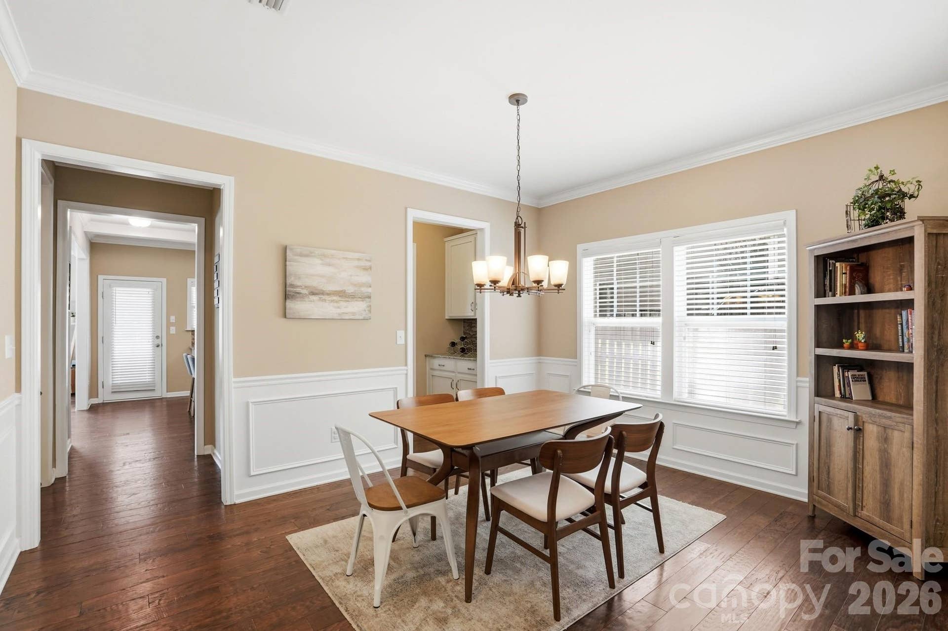 1198 Jasmine Drive, Fort Mill, SC 29707 Dining area with chair rail molding and custom lighting