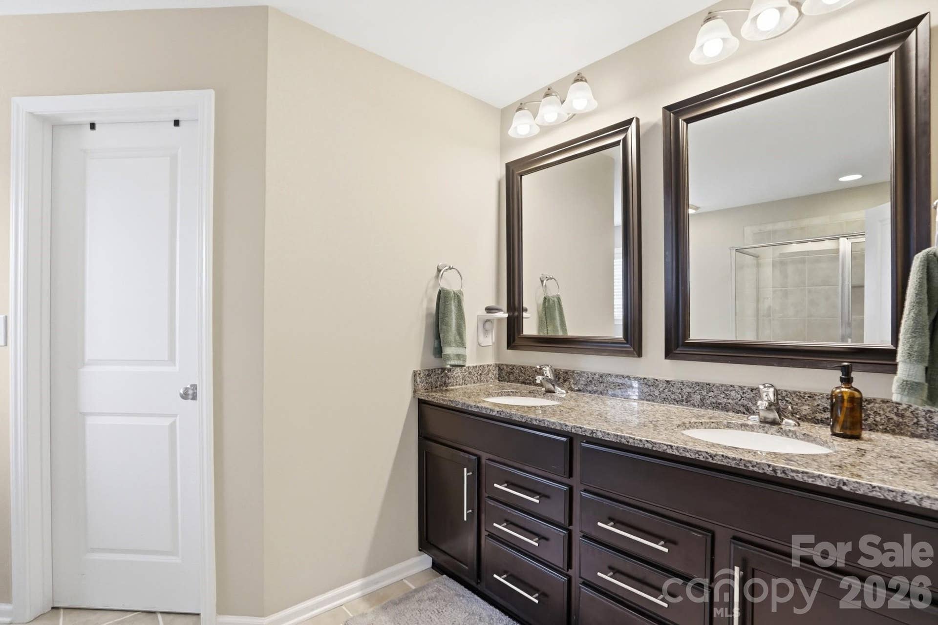 1198 Jasmine Drive, Fort Mill, SC 29707 Dual sinsk with granite counter tops and custom mirrors in primary